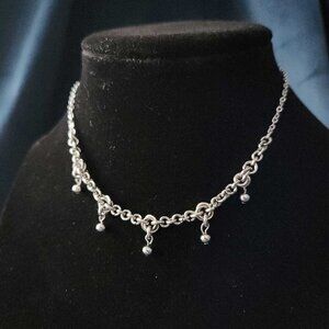 Gothic silver chainmaille necklace with a small silver chain